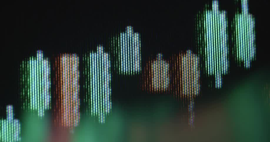 Close up of a candle diagram stock chart pattern on a digital RGB TV screen consisting of pixels and green and red candles as the graph rises with a positive upward tendency symbolising financial success and share trading