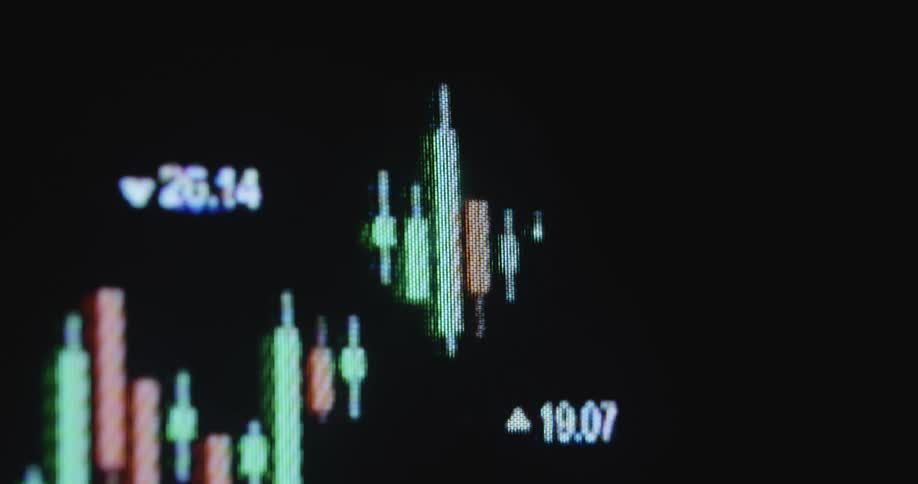 A candle diagram graph plots an array of data on a pixel screen with numbers representing rising and falling real estate prices or changes in the stock market or crypto currency finance sector
