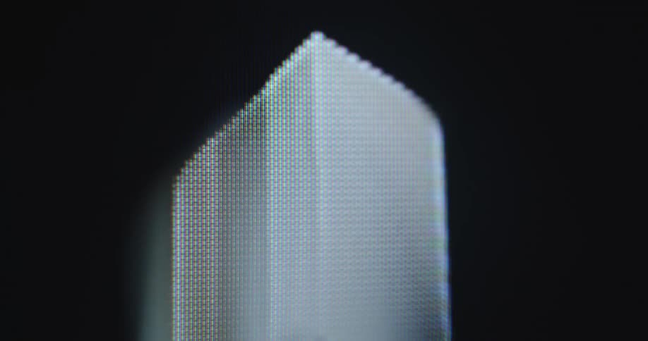 Rotating animation of three-dimensional cardboard box on a dark pixel tv screen representing shipment or dispatching service by shipping providers in the modern digital world and e-commerce era with online shopping