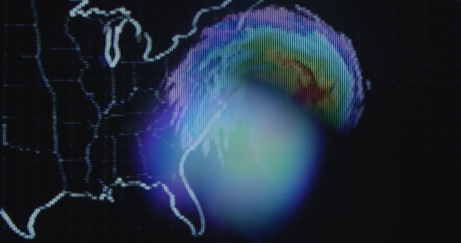 The pixelated television display shows a weather pattern of a storm front or hurricane on a map hitting the east coast of the United States of America