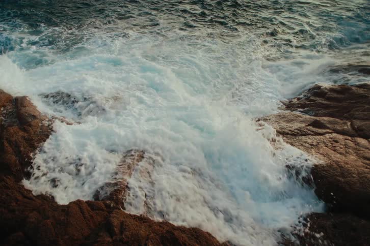 Ocean waves crashing against rocks