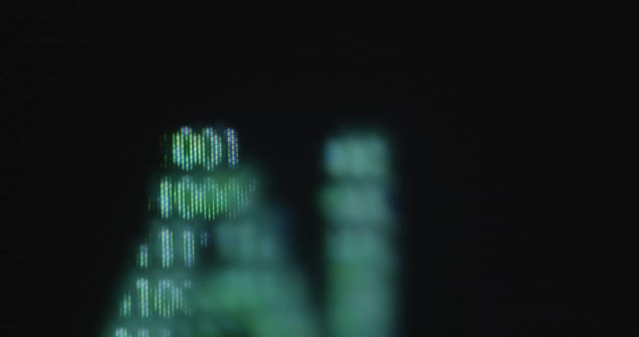 Initials AI as symbol for Artificial Intelligence are created by the neon green numbers or digits 0 and 1 or zero and one rapidly changing in the shape of the letters on a pixelated TV or computer screen with RGB pixels