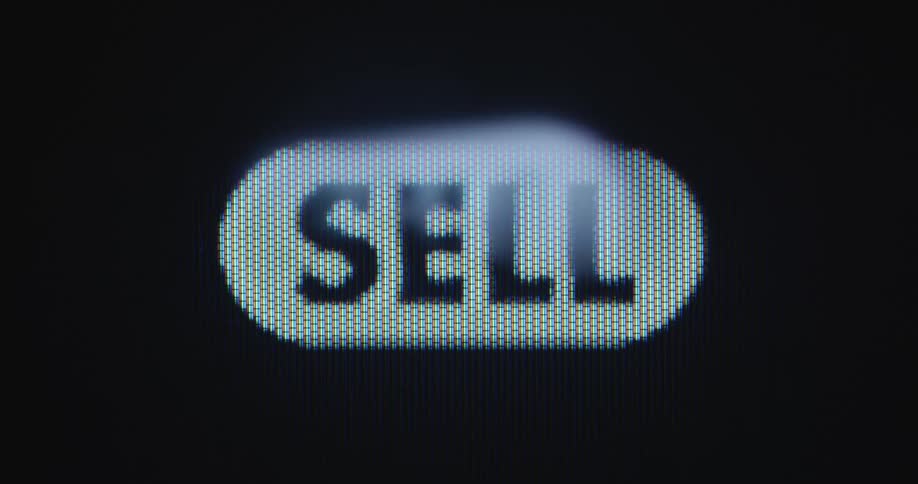 Mouse cursor clicks on a sell button displayed on a computer or PC screen in order to sell a product on a digital online market place or to trade shares on a stock exchange