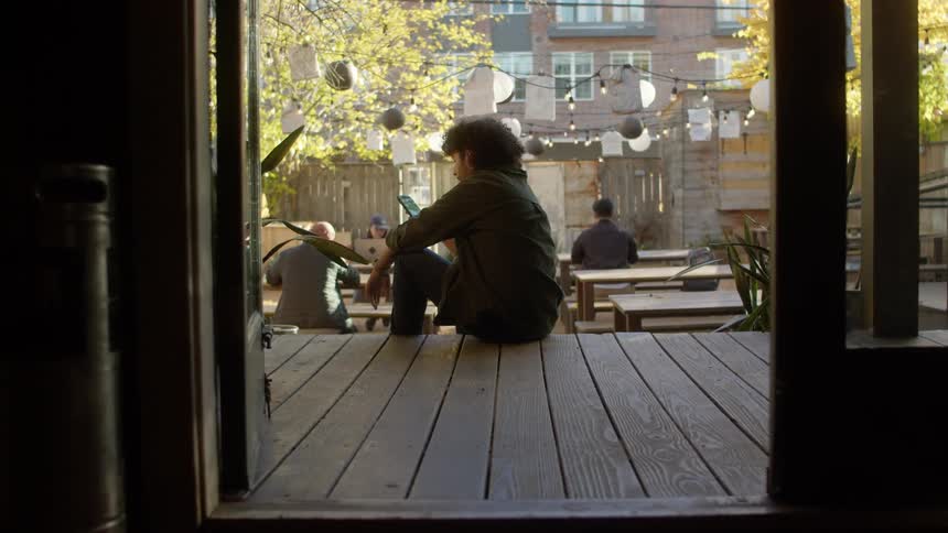 Man sitting using a cellphone