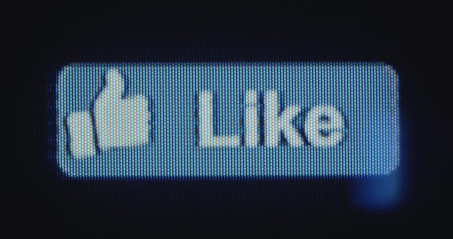 A blue like button is moving back and forth on a dark TV or computer screen as a call to action for social media engagement
