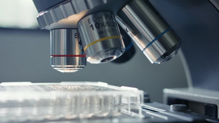 Close up of a microscope analyzing samples