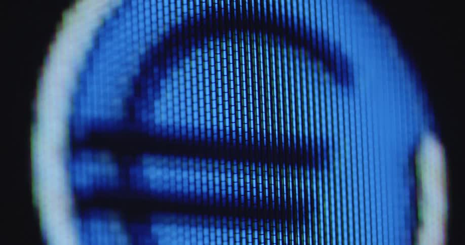 Extreme macro closeup of a digital screen with pixels showing a moving and pulsating blue Euro or € symbol representing financial markets in the internet and online banking applications in our digital world