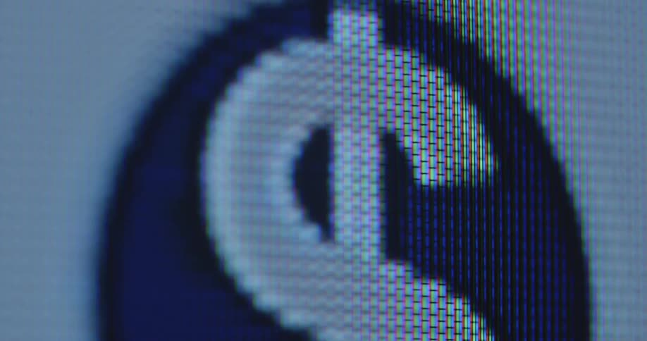 Macro close up of animated $ sign in the stars and stripes colors white blue and red on a screen as symbol for a digital USD dollar crypto currency powered by blockchain technology as the future of finance