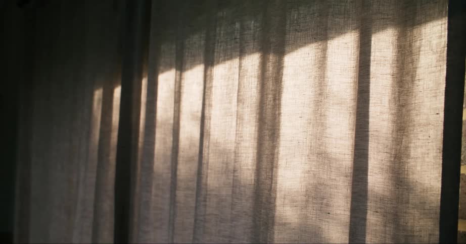 Closeup of a curtain with sunlight reflection