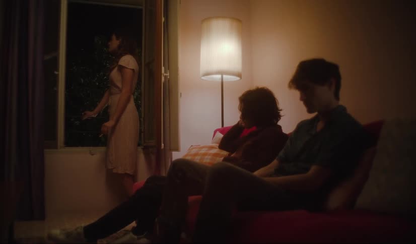 Friends waiting in the living room caught on vintage film