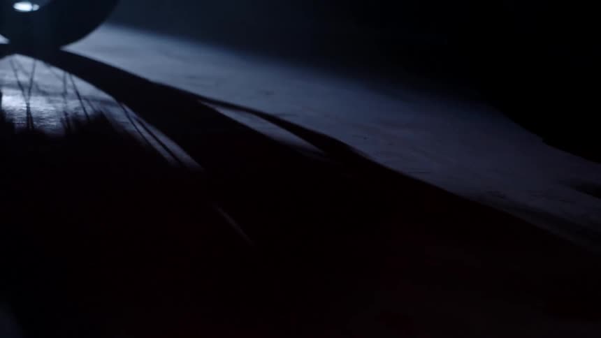 A wheel is rolling in the dark