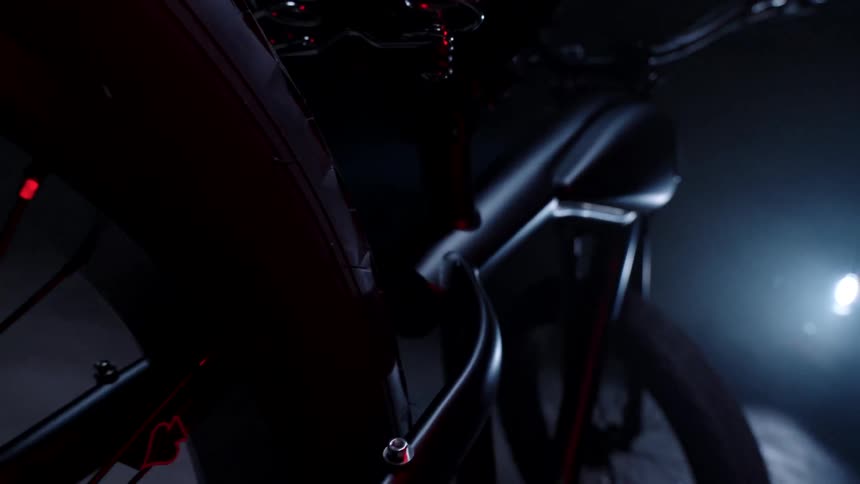 View of a red motorcycle inside a dimly lit room