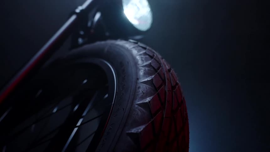A rubber tire from a vehicle that has a light on