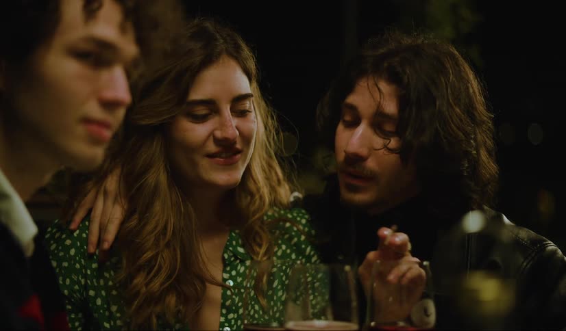 Group of friends talk at a party