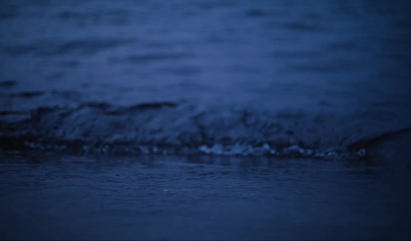 Shoreline of a beach at nightfall