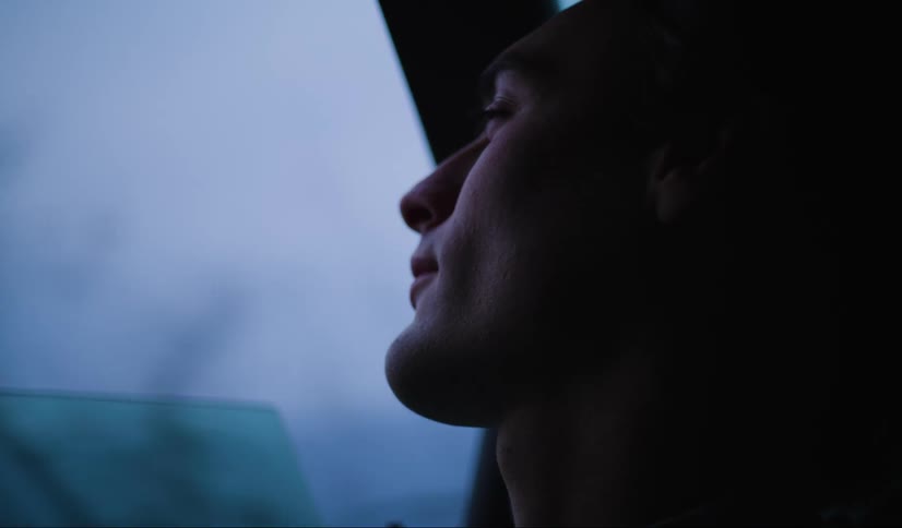 A man is riding in the vehicle