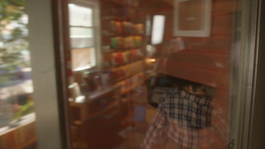 Woman enters a small coffee shop