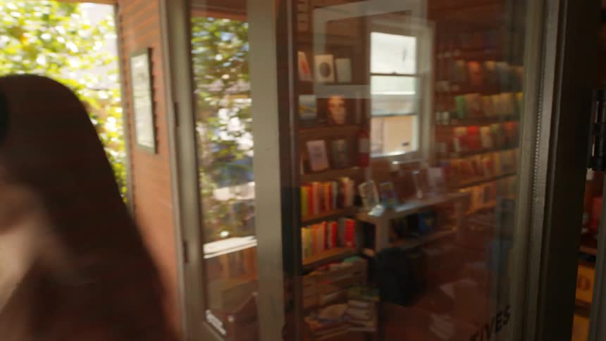 Woman exits a coffee shop
