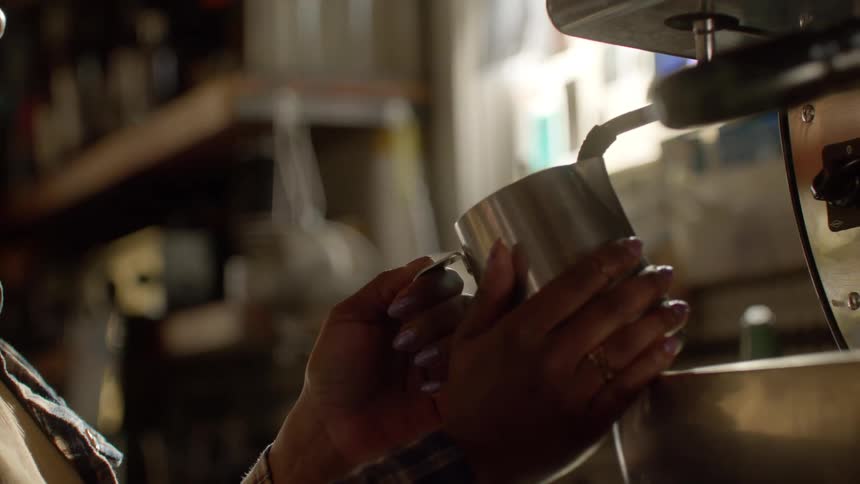 A woman serving a coffee in a coffee shop