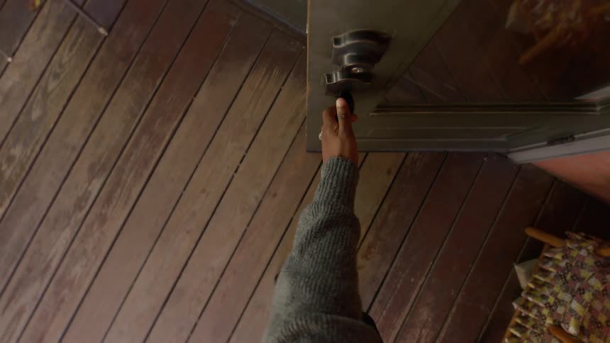 A person opening and shutting a door