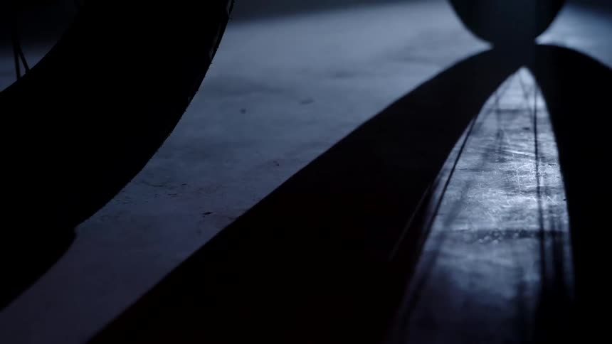 Close up of the wheels of a motorcycle moving