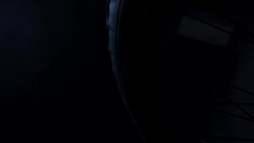 Close up of a bicycle inside a dimly lit room
