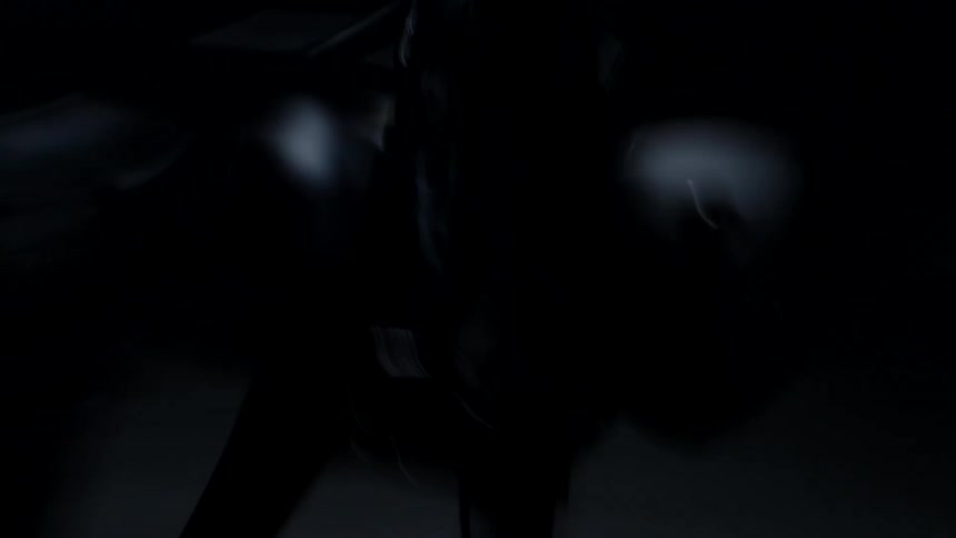Chaotic orbiting close up of a black motorcycle