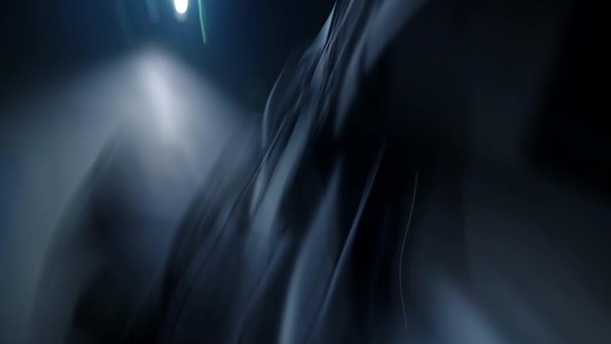 Chaotic close up of a dark motorcycle or bicycle