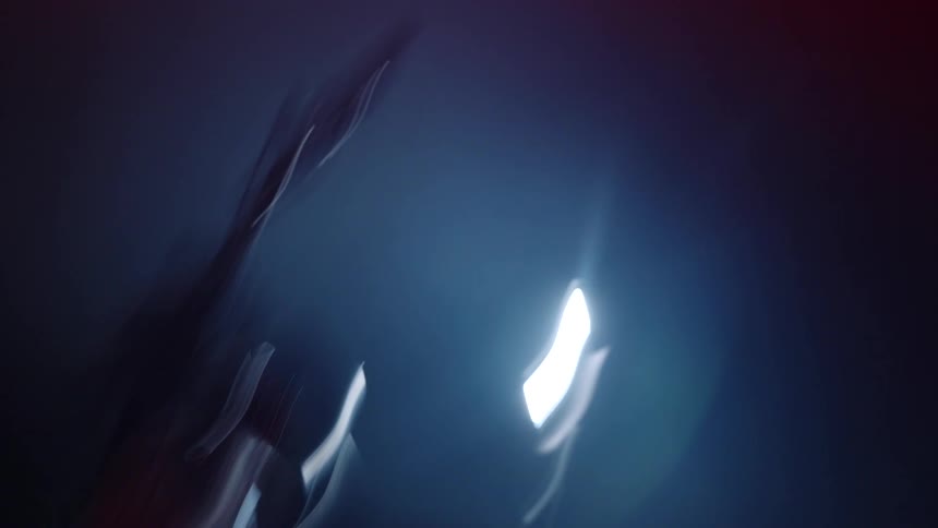 A motorcycle is in the dark garage