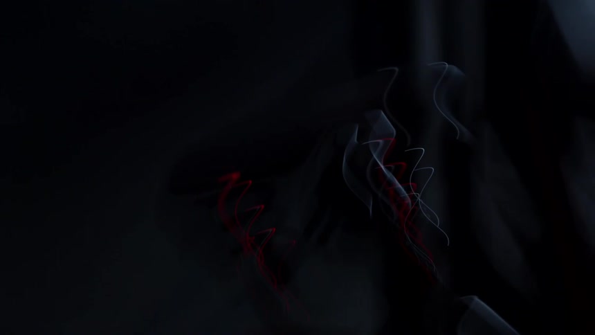 A motorcycle is parked in the dark