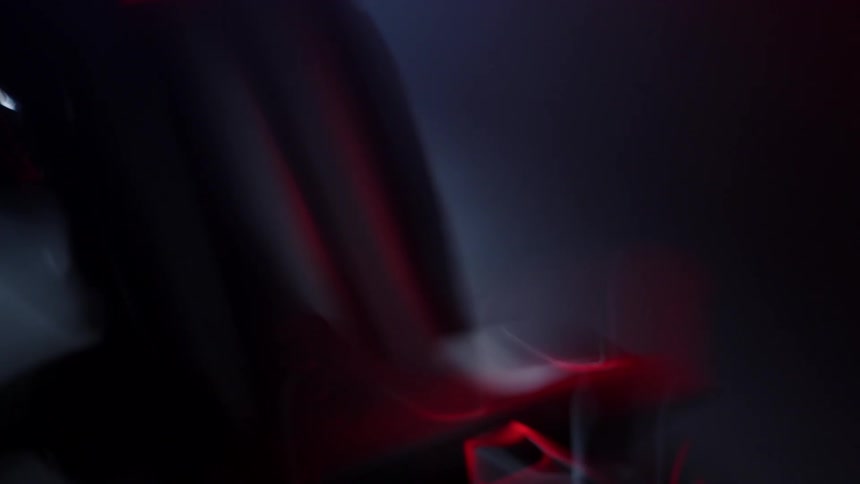 A motorcycle is parked in the dark garage