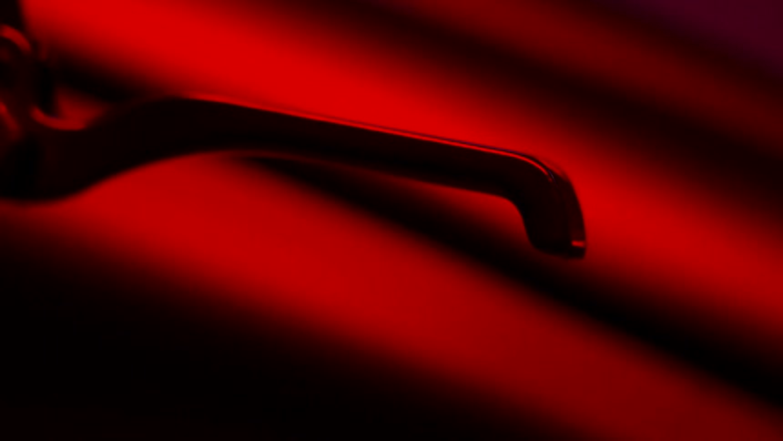 A pedal is in a dark room