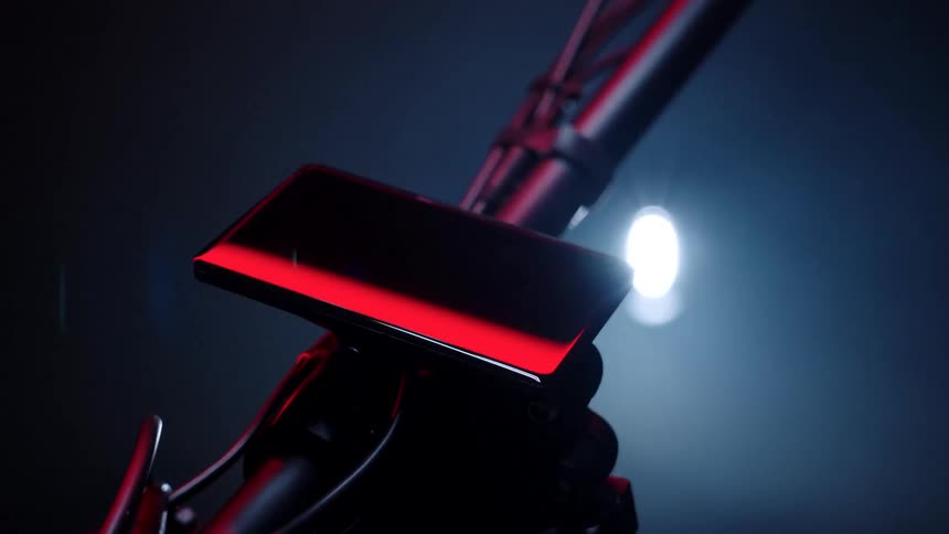A cell phone is on the motorcycle
