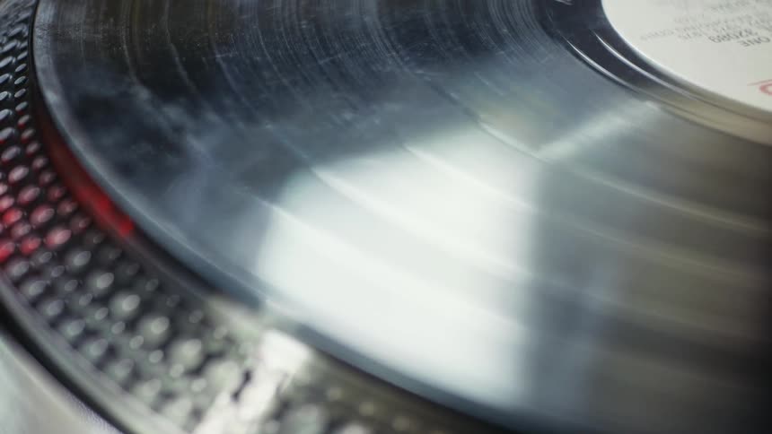 A vinyl record spinning on a player