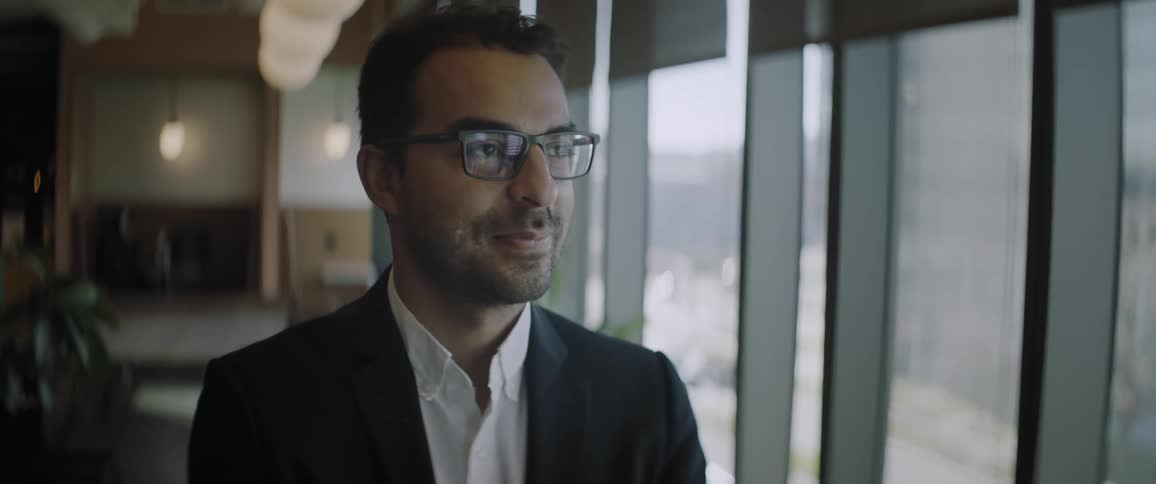 Closeup of a mans face wearing prescription glasses