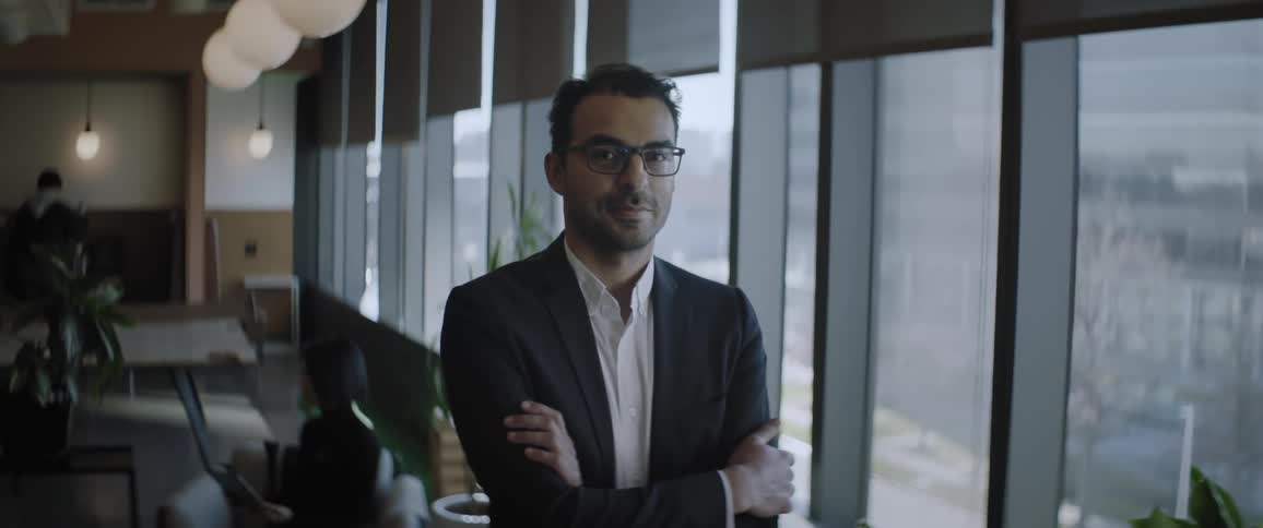 Businessman crosses his arms in the office
