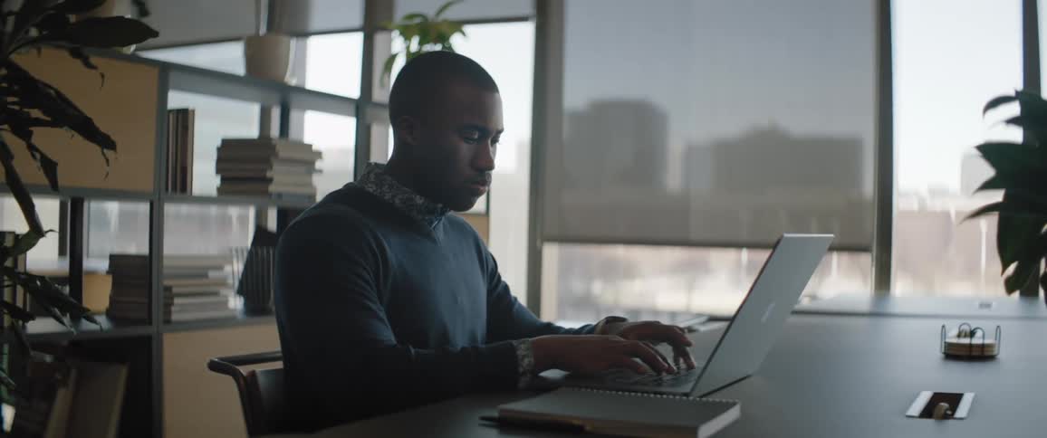 Man working on a laptop at the office