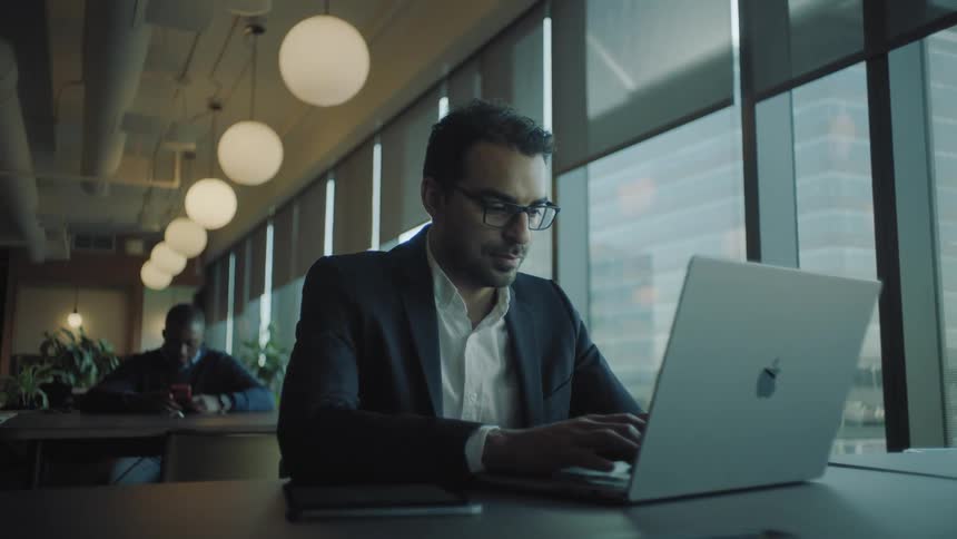 Businessman working on a laptop at the office