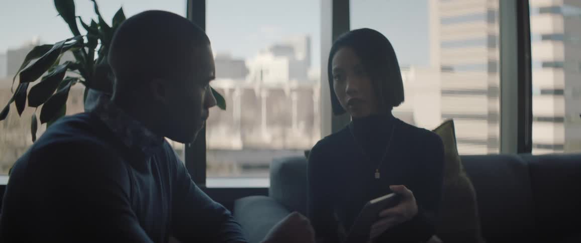 Coworkers have a conversation in the office