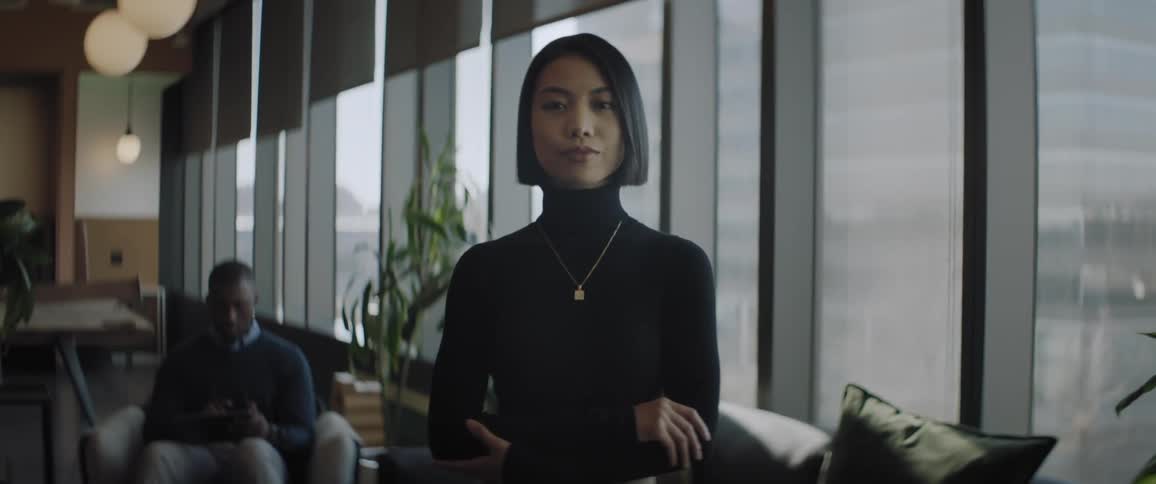 A woman is standing in the office