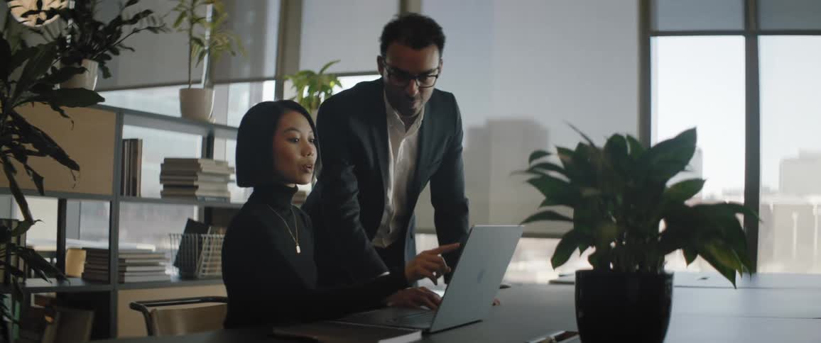 A man and a woman in a business meeting in an office