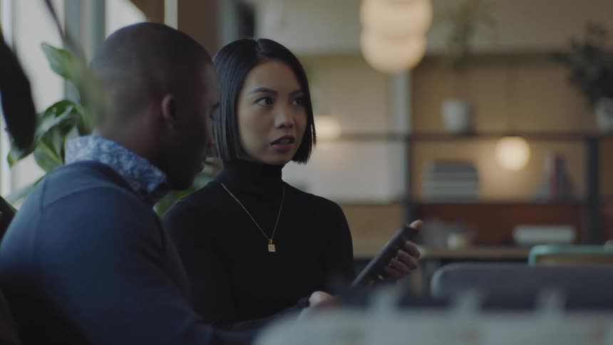 A clip of a black male chatting with an asian lady