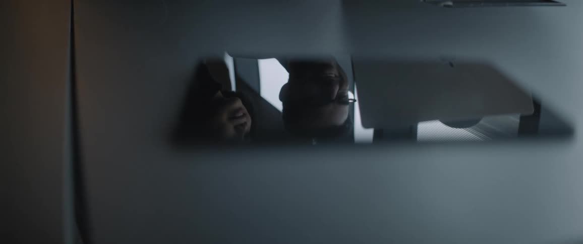 Reflection of a person seen through a device