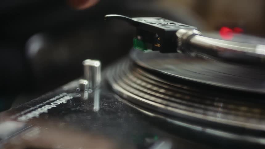 A close up clip of a person playing a music tape