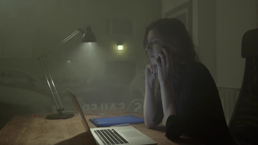 An ambitious woman contacts a business partner to finalize details on an assignment.