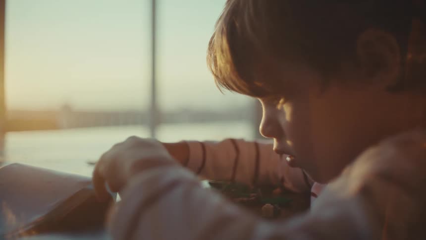 A child is building with legos
