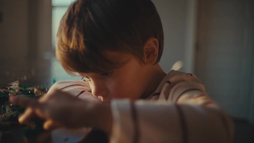 A kid is indoor playing with his toys