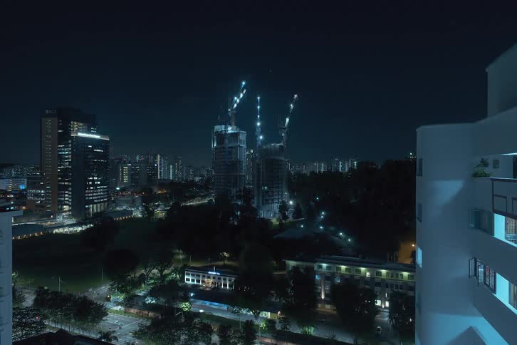 A skyscraper rises over time in the city