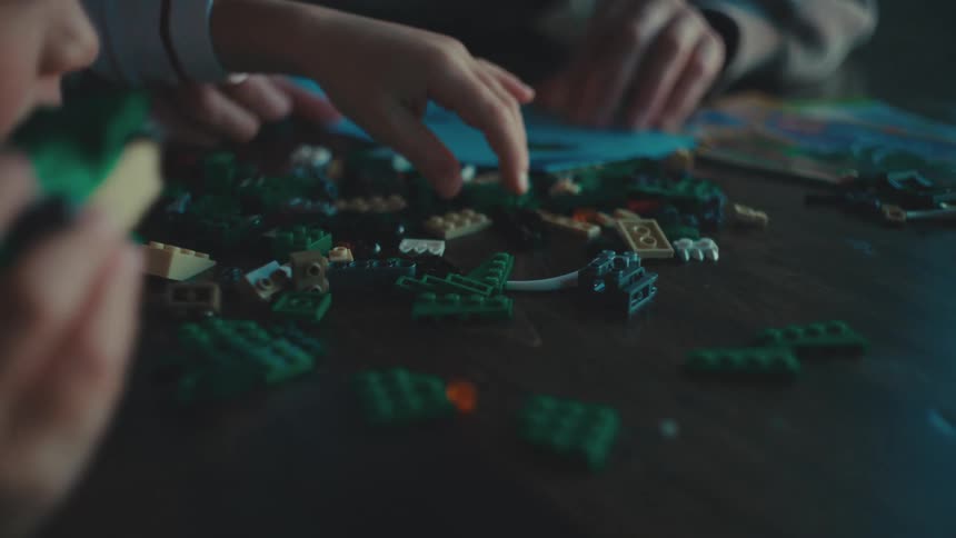 Lego pieces on a dark wooden table