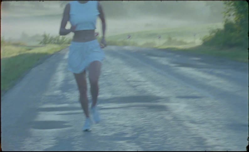 A woman is running down the road